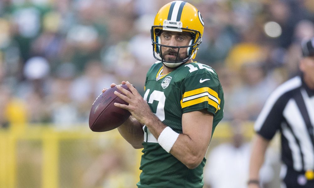 Aaron Rodgers tells reporters he has been playing through a broken thumb on his throwing hand