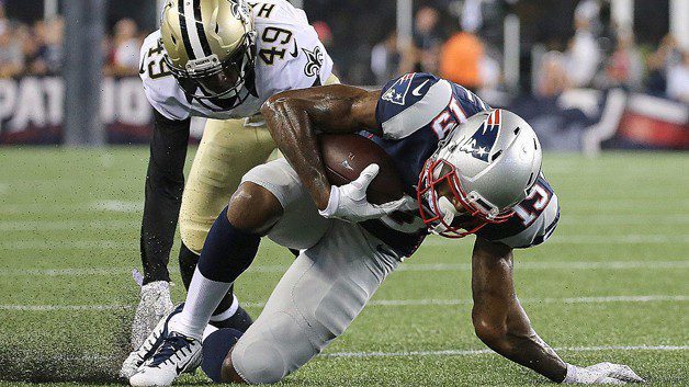 FOXBORO, MA - AUGUST 11:  Malcolm Mitchell #19 of the New England Patriots injures his arm on a run as De'Vante Harris #49 of the New Orleans Saints defends in the first half during a preseason game against the New Orleans Saints at Gillette Stadium on August 11, 2016 in Foxboro, Massachusetts. (Photo by Jim Rogash/Getty Images)