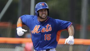 Tim Tebow reacts after hitting a solo home run in his first at bat during the first inning of his first instructional league baseball game for the New York Mets against the St. Louis Cardinals instructional club Wednesday, Sept. 28, 2016, in Port St. Lucie, Fla.  (AP Photo/Luis M. Alvarez)