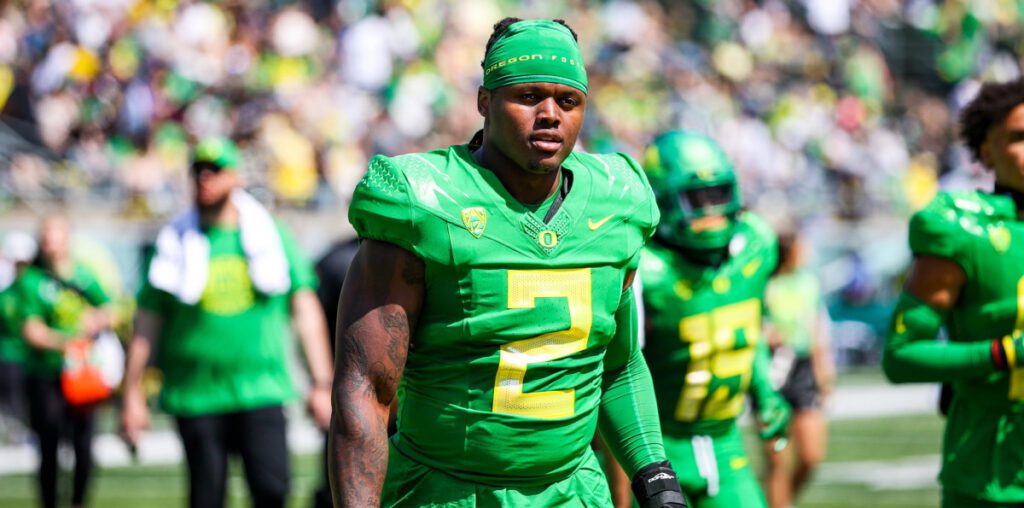 Oregon football player punches an Oregon State fan in the face after the game