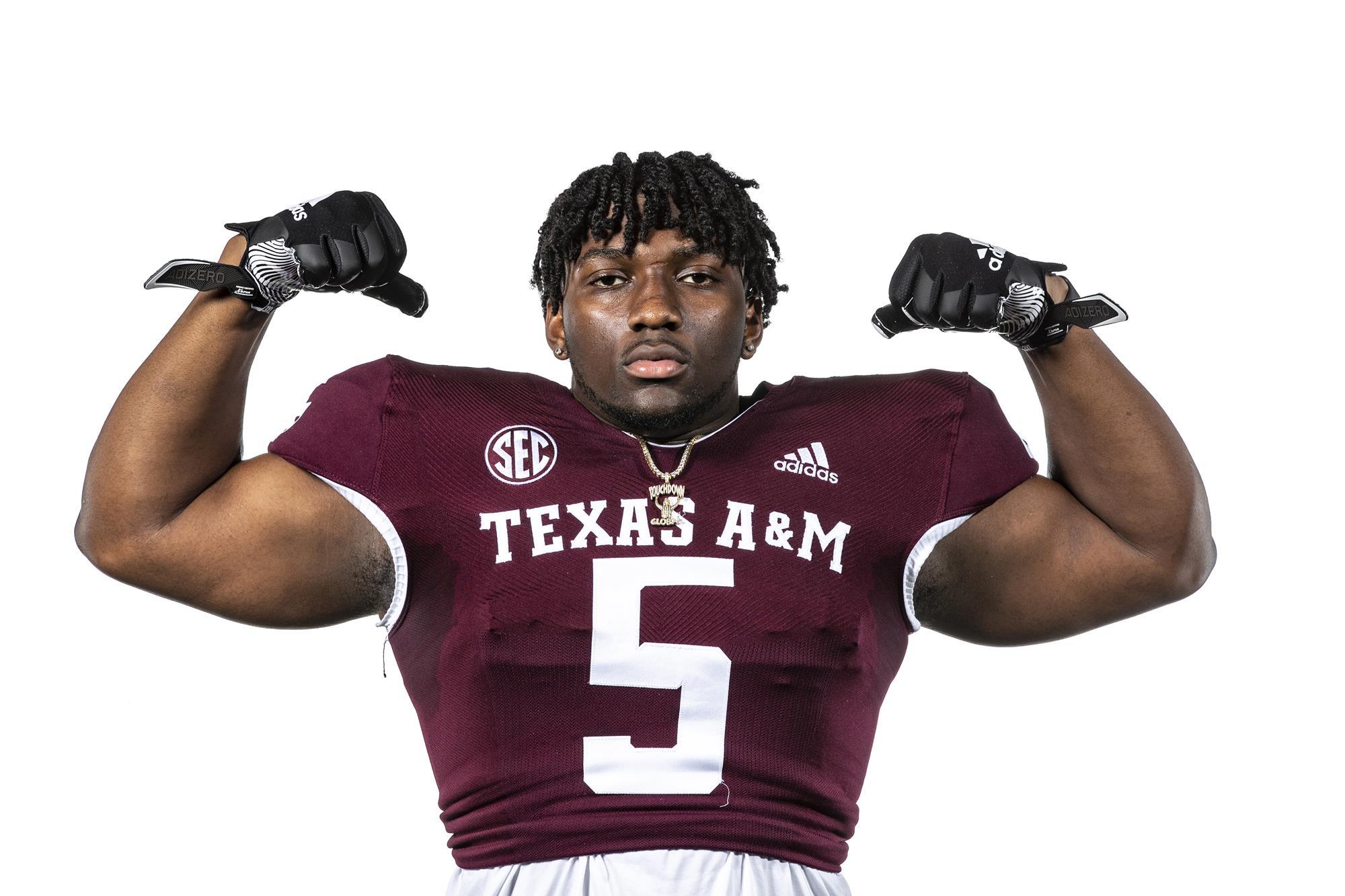 VIDEO: Texas A&M football player nails a player with a low blow and then swings on him